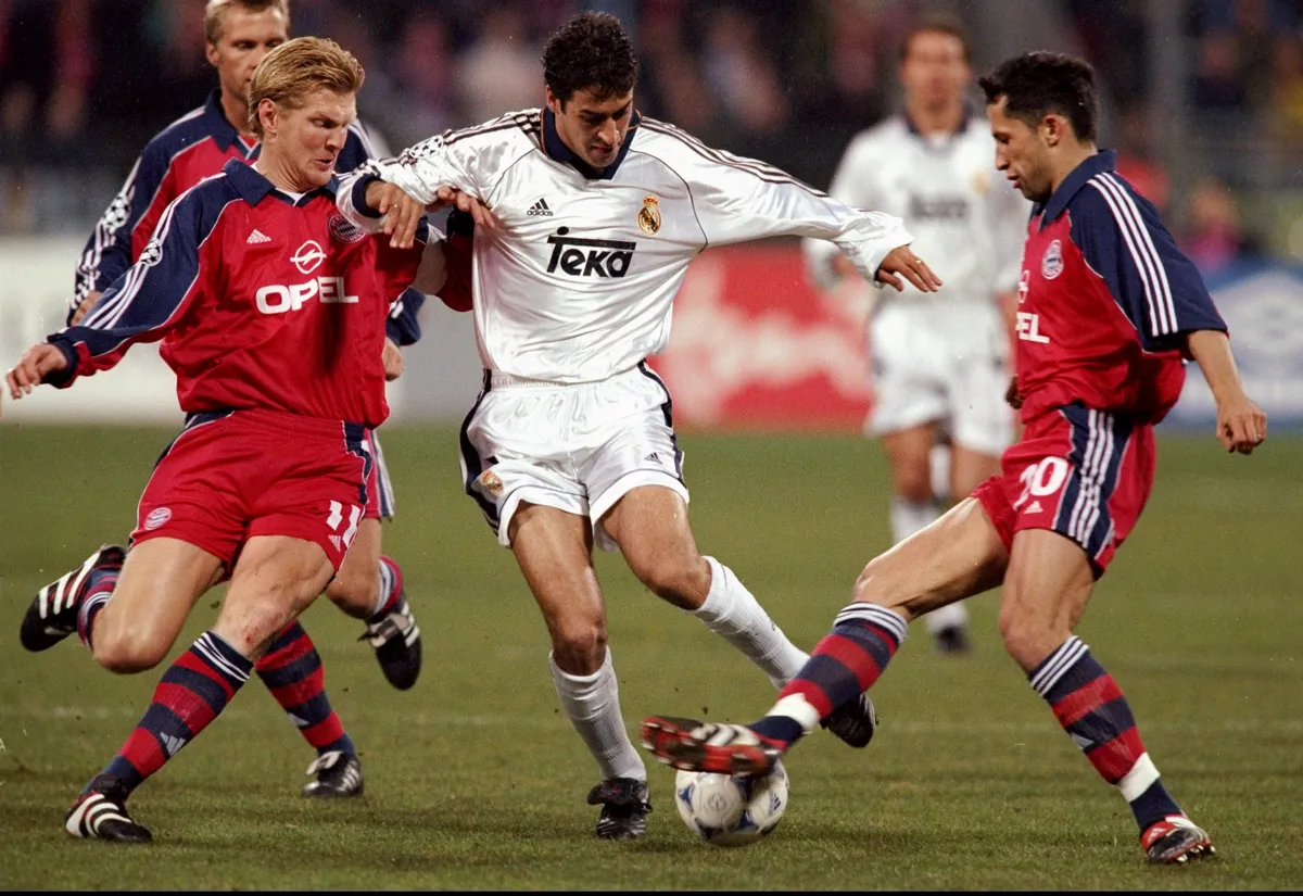 Real Madrid striker Raul Gonzalez is challenged by Bayern Munich pair Stefan Effenberg and Steffan Effenberg and Nils Eric Johansson in a Champions League clash in 2000.