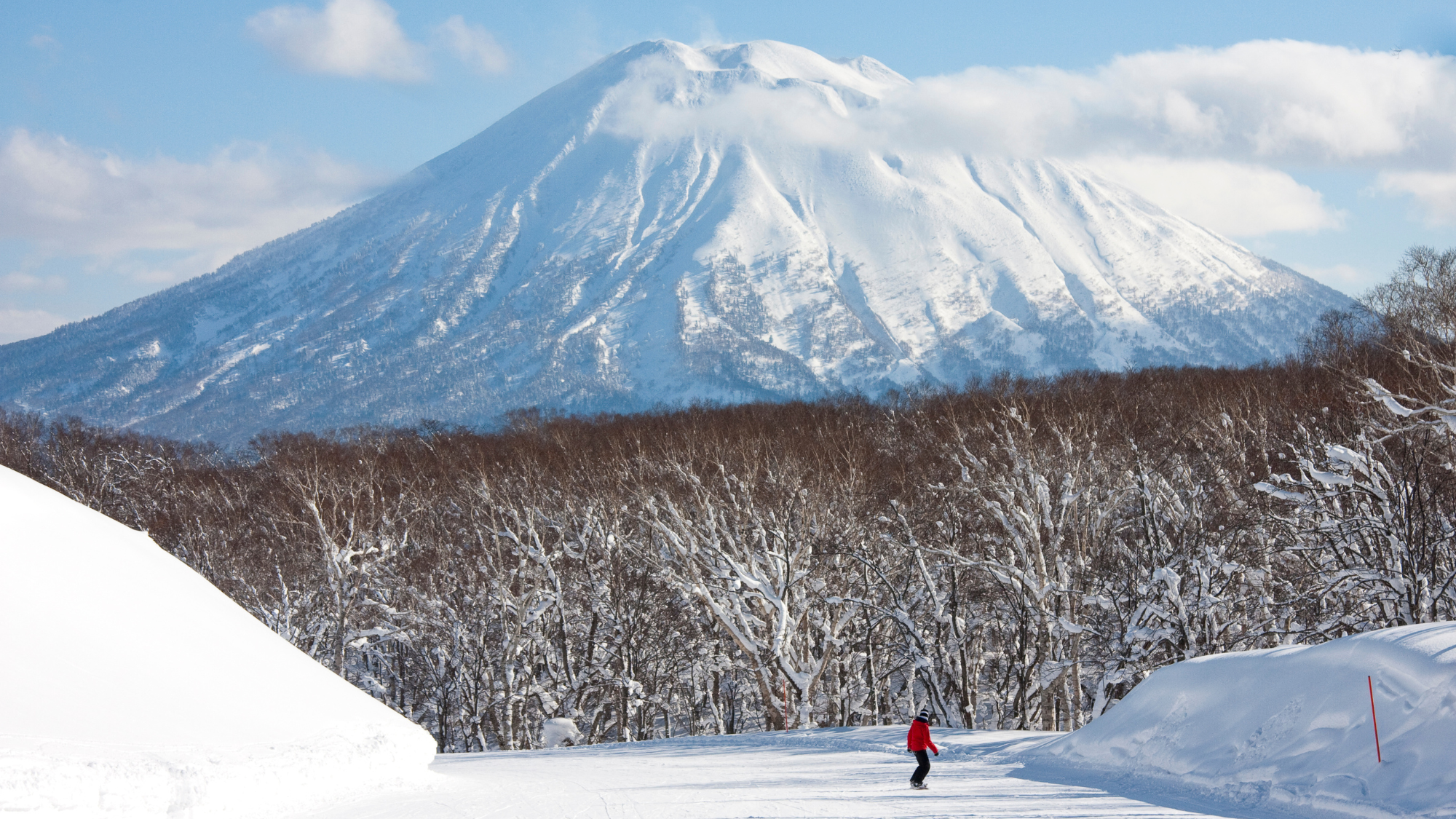 Person skiing in front of Mount Yotei, Niseko