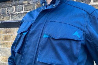 Image shows the chest pocket of the Altura Grid Field Jacket