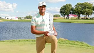 Tony Finau with the trophy after his win in the 2022 3M Open