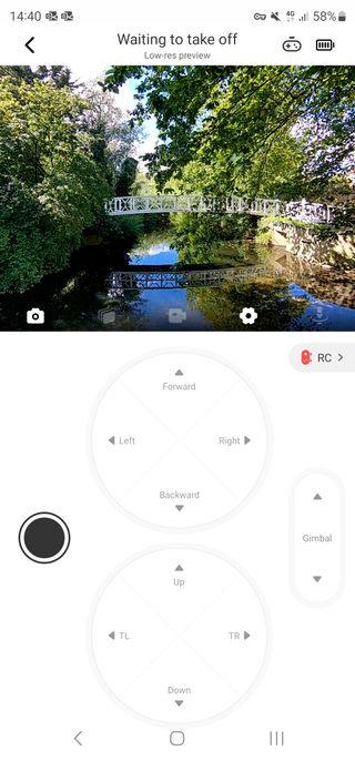 Screenshot of the drone app control screen with directional keys at the bottom and video view at the top.