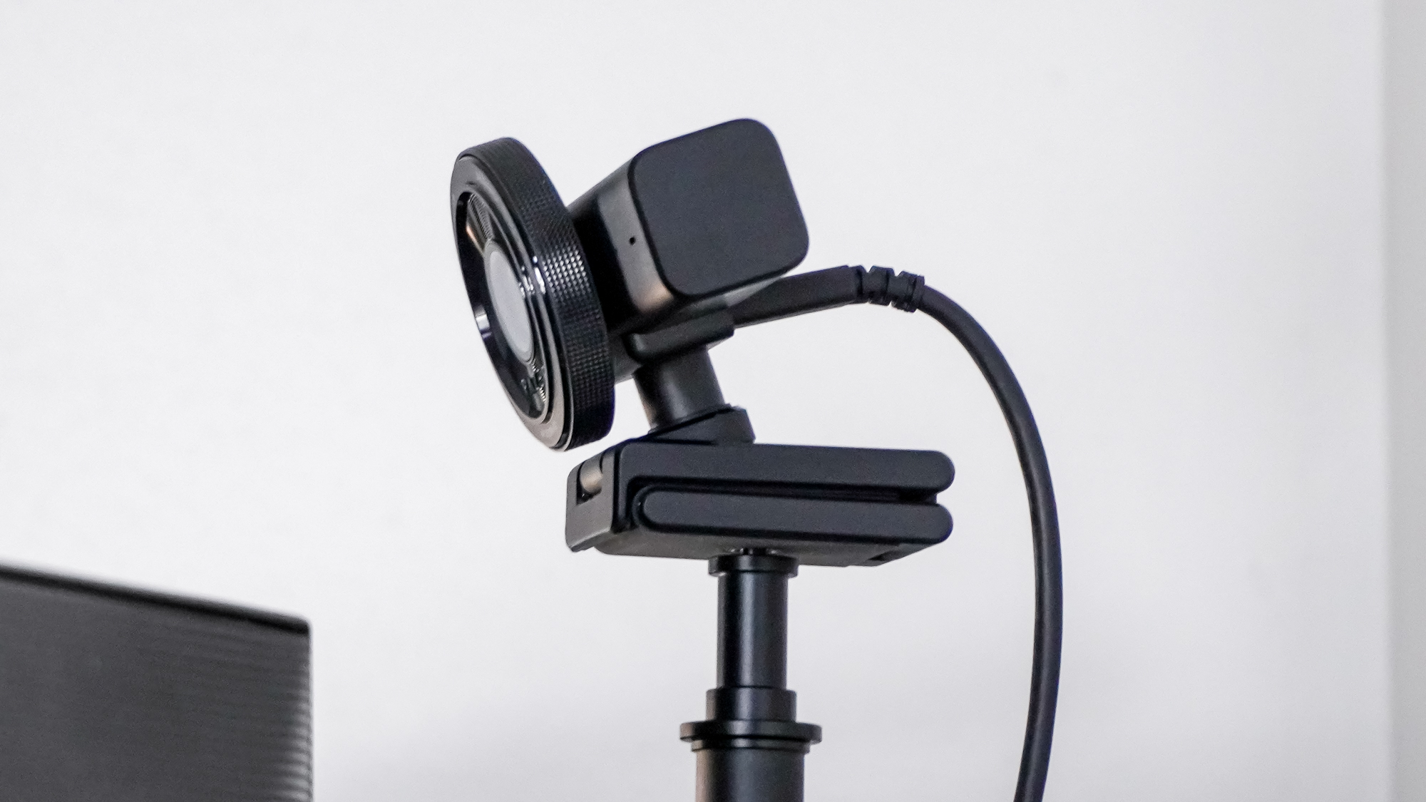 The Razer Kiyo V2 webcam mounted on the SmallRig Camera Desk Mount behind a dual-monitor setup