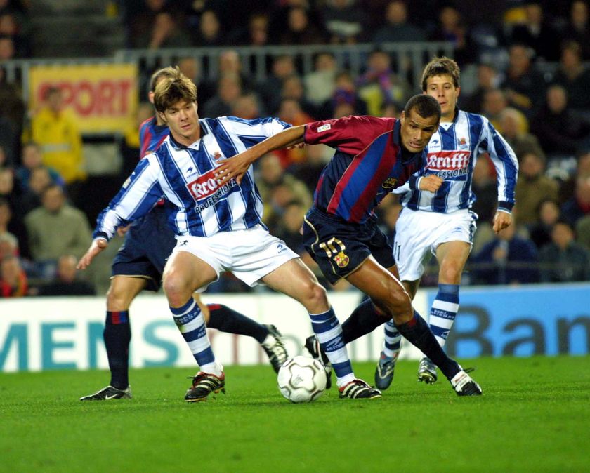 06 Feb 2002: Xavi Alonso of Real Sociedad and Rivaldo of Barcelona in action during the Primera Liga match between Barcelona and Real Sociedad, played at the Camp Nou, Barcelona. DIGITAL IMAGE Mandatory Credit: Firo Foto/ALLSPORT