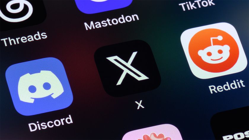 Phone screen showing Discord, X, and Reddit app icons