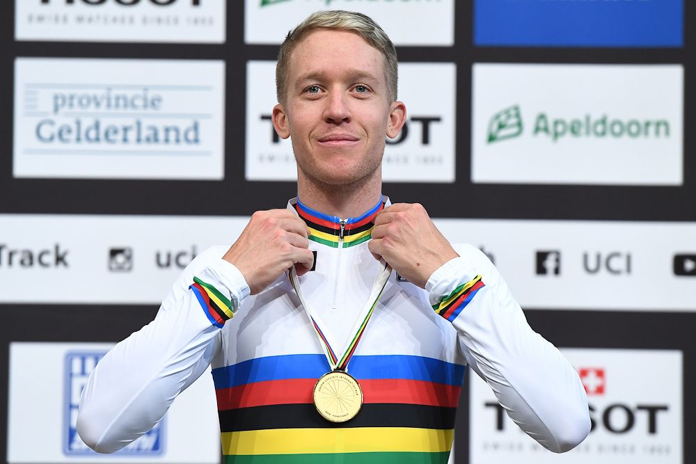Gold medallist Australian Cameron Meyer poses on the podium after the men's points race final during the UCI Track Cycling World Championships in Apeldoorn