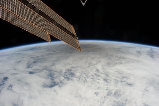 This is one of a series of photos taken by Expedition 31 Flight Engineer Don Pettit aboard the International Space Station, showing a shadow of the moon created by the May 20, 2012 solar eclipse, as the shadow spreads across cloud cover on Earth. Pettit used a 28-mm lens on a digital still camera.