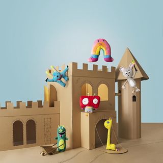colourful sagoskatt cuddly toys with cardboard castle