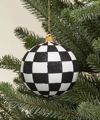 Black and white round checkered christmas ornament on tree