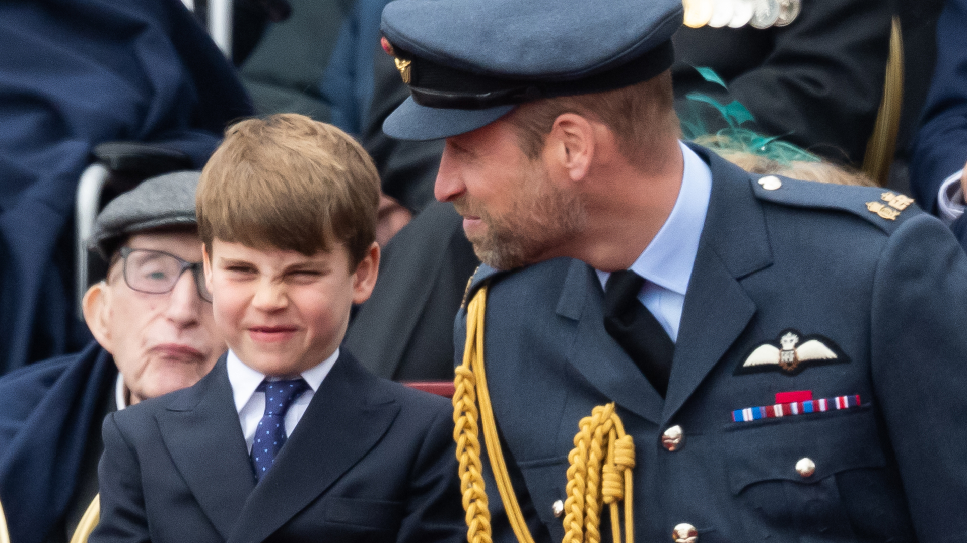 Prince Louis and Prince William sitting next to each other at the VE Day 80 parade