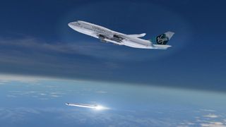 An artist's illustration of Virgin Galactic's new 747 jumbo jet "Cosmic Girl" launching a LauncherOne rocket from high altitude. Virgin Galactic unveiled the rocket-toting carrier plane on Dec. 3, 2015.