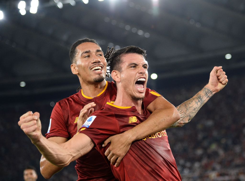 Roger Ibanez of AS Roma celebrates with teammate Chris Smalling after scoring goal -0 during the Serie A match between AS Roma and AC Monza at Stadio Olimpico on August 30, 2022 in Rome, Italy.