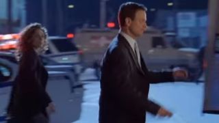 Gary Sinise walking in a suit in CSI: New York