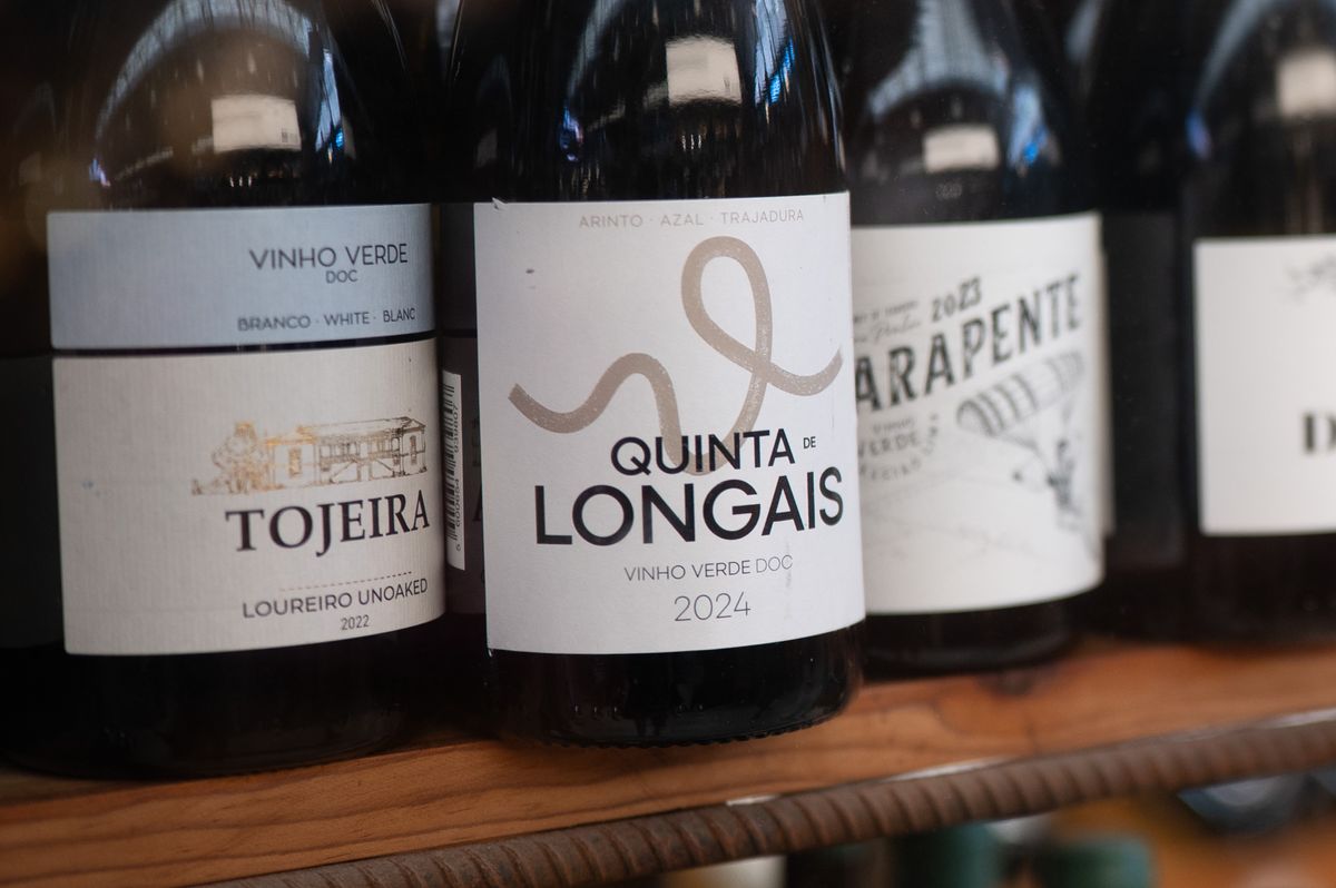 Sample images taken with Viltrox AF 35mm F1.4 Pro and Sigma 35mm f/1.4 DG HSM Art lenses; bottles of wine in a shop