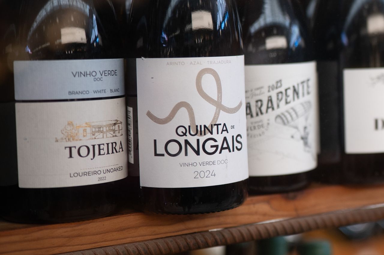 Sample images taken with Viltrox AF 35mm F1.4 Pro and Sigma 35mm f/1.4 DG HSM Art lenses; bottles of wine in a shop