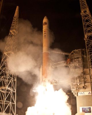 A United Launch Alliance Delta 4 rocket blasts off from Space Launch Complex-37 with the Air Force's Wideband Global SATCOM-4 (WGS-4) satellite at 7:38 p.m. EST on Jan. 19, 2012.