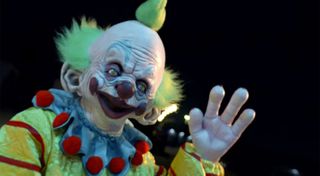 An evil clown waves from above in 'Killer Clowns From Outer Space'