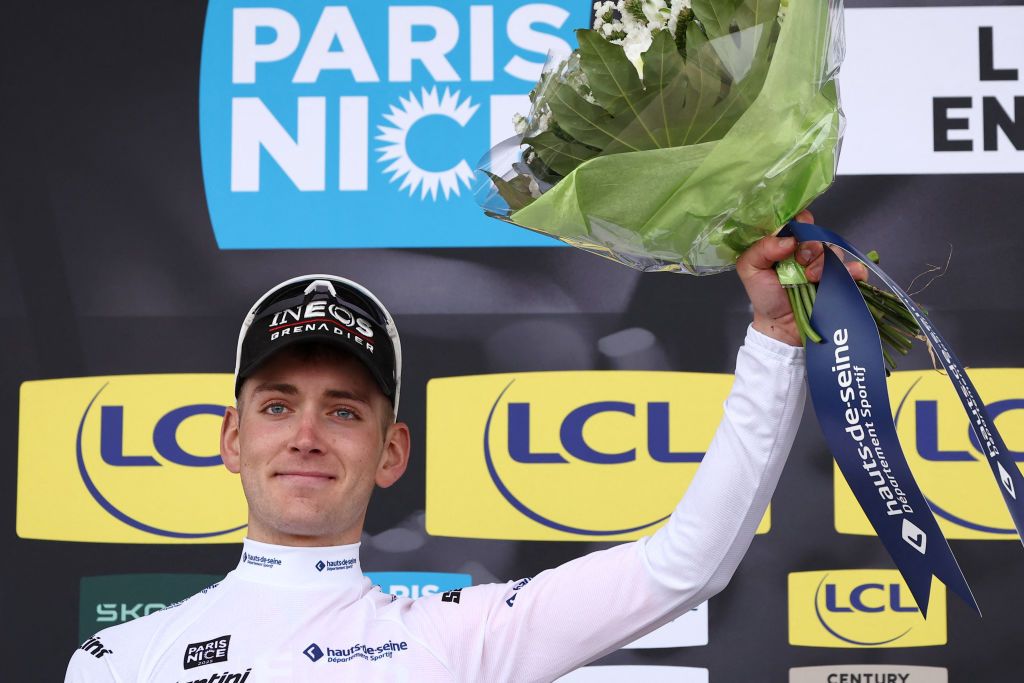 Ineos Grenadiers' US rider Magnus Sheffield celebrates on the podium wearing the best young rider's white jersey after the 1st stage of the Paris-Nice cycling race, 156,1 km between Le Perray-en-Yvelines and Le Perray-en-Yvelines, on March 9, 2025. (Photo by Anne-Christine POUJOULAT / AFP)