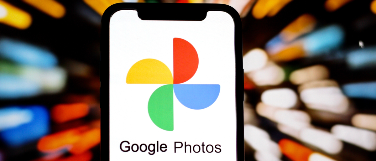 A phone with the Google Photos logo on the screen