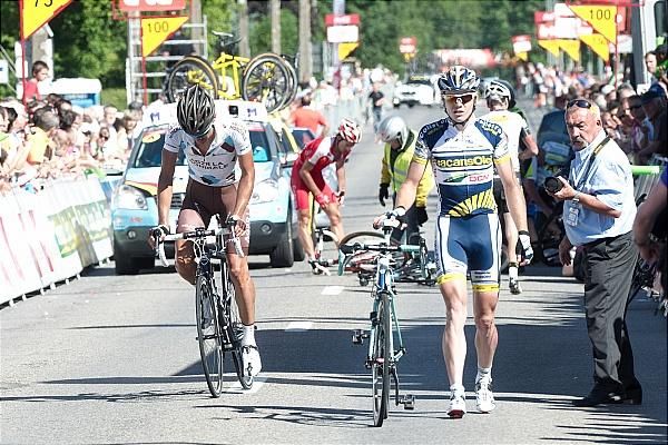 Guillaume Bonnafond (AG2R La Mondiale) and Pim Ligthart (Vacansoleil-DCM) make their way to the finish line after crashing in the finale.