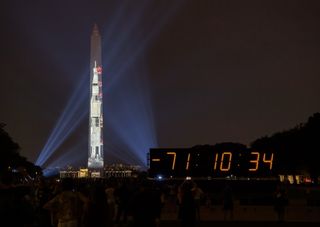 A full-size projection of NASA's Saturn V rocket lit up the Washington Monument in honor of the 50th anniversary of the launch of the Apollo 11 moon mission yesterday (July 16).