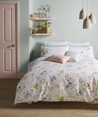Teenage bedroom ideas: Pink bedroom door and chair with floral Cath Kidston bedding