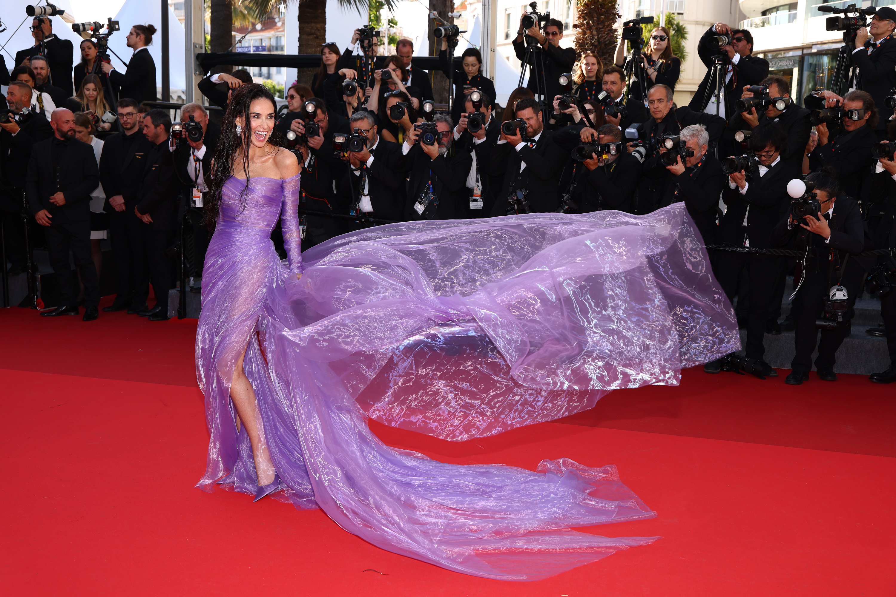 Demi Moore wears a purple dress