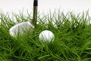 Golf ball in rough with club GettyImages-474341264