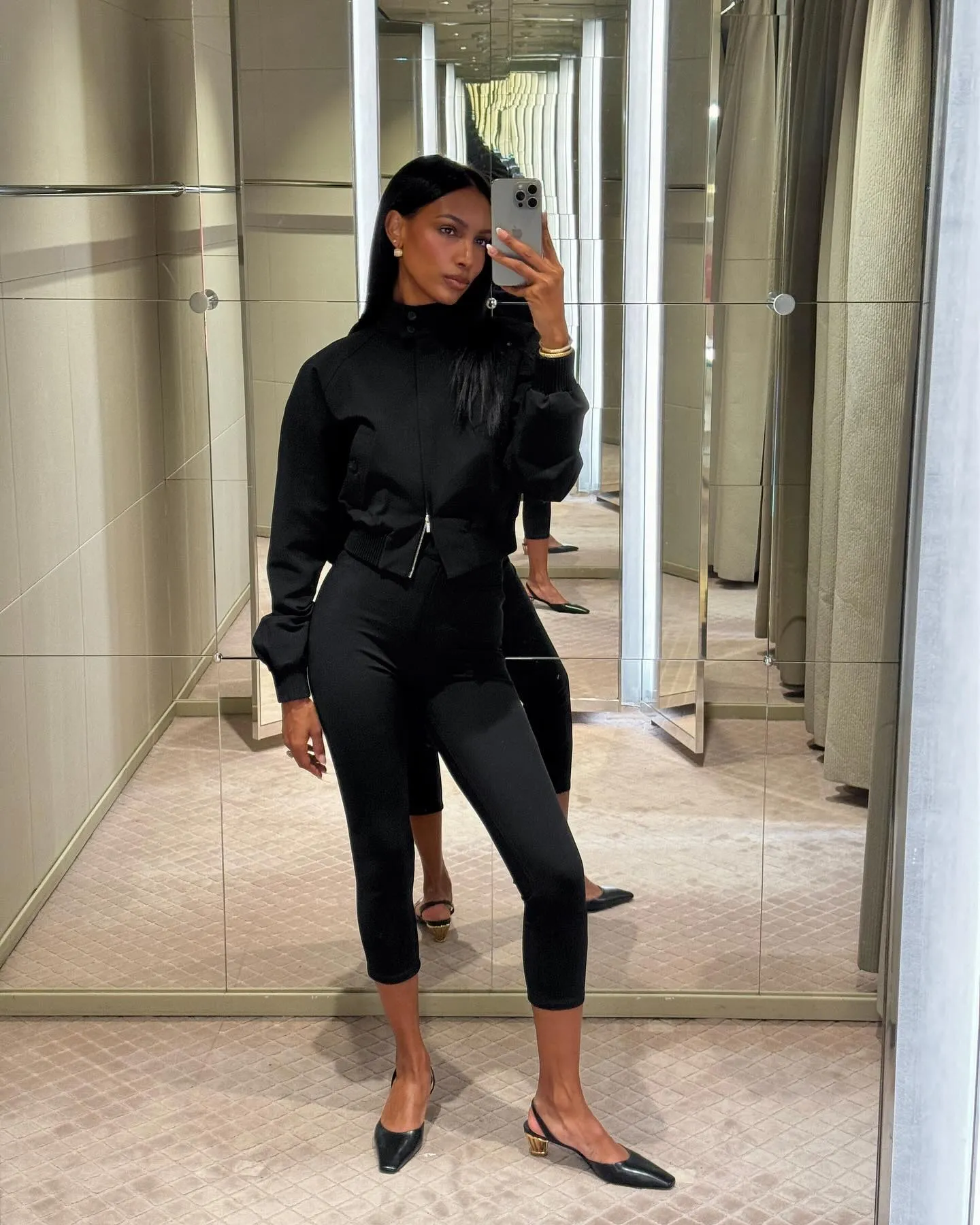 Jasmine Tookes wearing Capri leggings and a windbreaker outfit