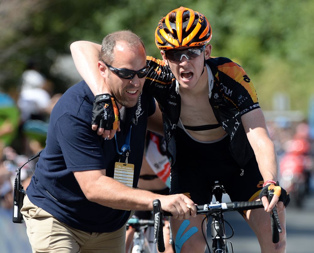 Chad Haga (Optum Pro Cycling) is helped off the course after a sixth place finish at the Palm Springs Aerial Tramway during Stage 2 of the 2013 Tour of California.