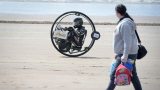 A man practices for a monowheel race in Wales, UK.