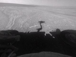 This view from the front hazard-avoidance camera on NASA's Mars Exploration Rover Opportunity shows the rover's arm's shadow falling near a bright mineral vein informally named "Homestake." 