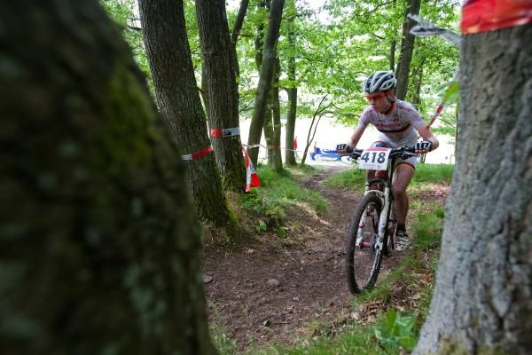 A woman races through the trees