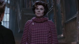 Professor Umbridge looking stern in a pink dress.