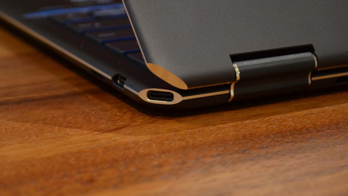 An HP Spectre x360 2022 on a wooden table