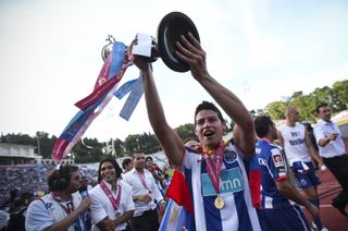 James Rodriguez celebrates with the Portuguese Cup after Porto's 6-2 win in the final against Vitoria Guimaraes in May 2011.