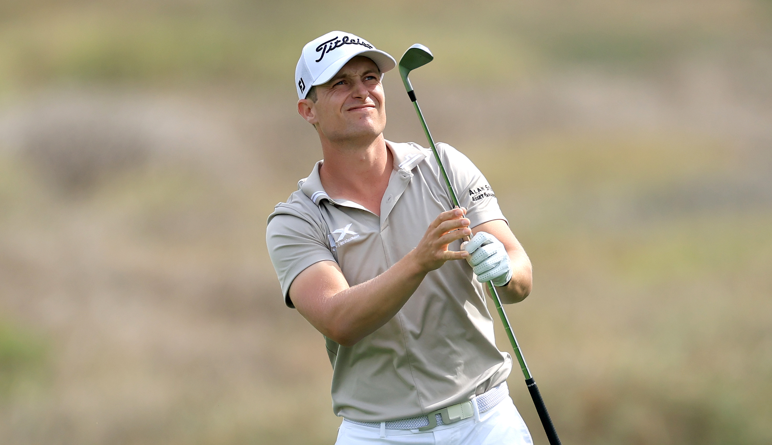 Calum Hill watches his approach shot