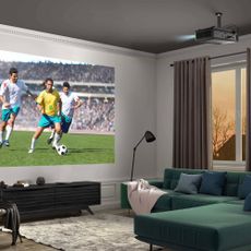 a projector in a living room showing football
