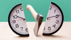 An ax has chopped a wall clock in half.