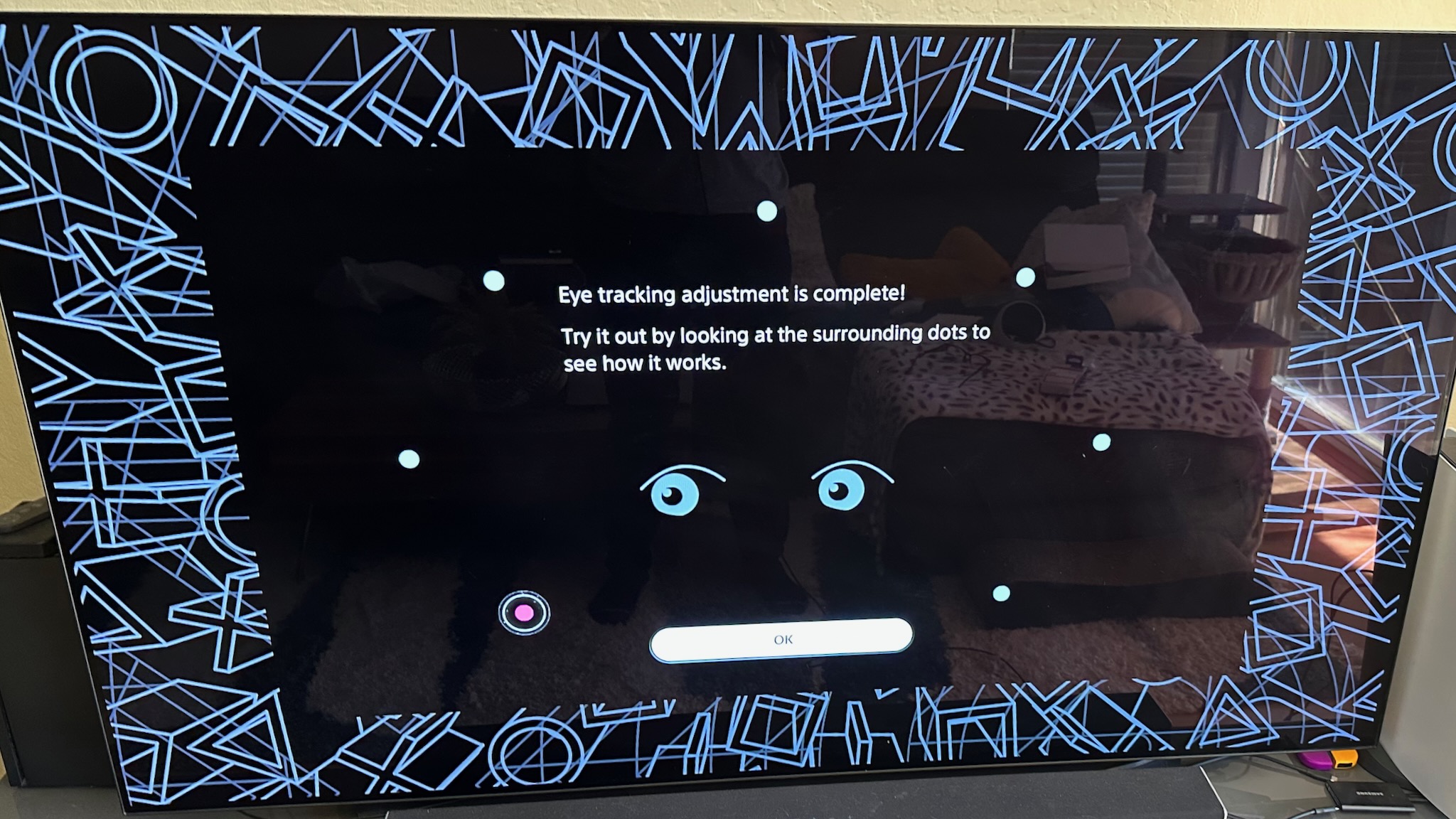 A TV showing eye tracking setup screen on the PS VR2.