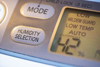 Air Purifier and dehumidifier. Concept for dehumidifying room. Humidity selection button. Humidity percentage display