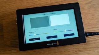 Blackmagic Video Assist 5 3G video monitor on a wooden surface