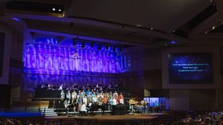 IPS installed a full audio ecosystem for the church, dimly lit here for a choral event, that included DiGiCo Quantum consoles, Fourier Audio transform.engines, and a KLANG:konductor paired with 16 KLANG:kontrollers