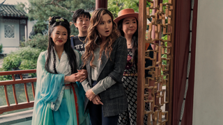 a group of young woman standing outside of a doorway in china in a still from the movie Joy Ride