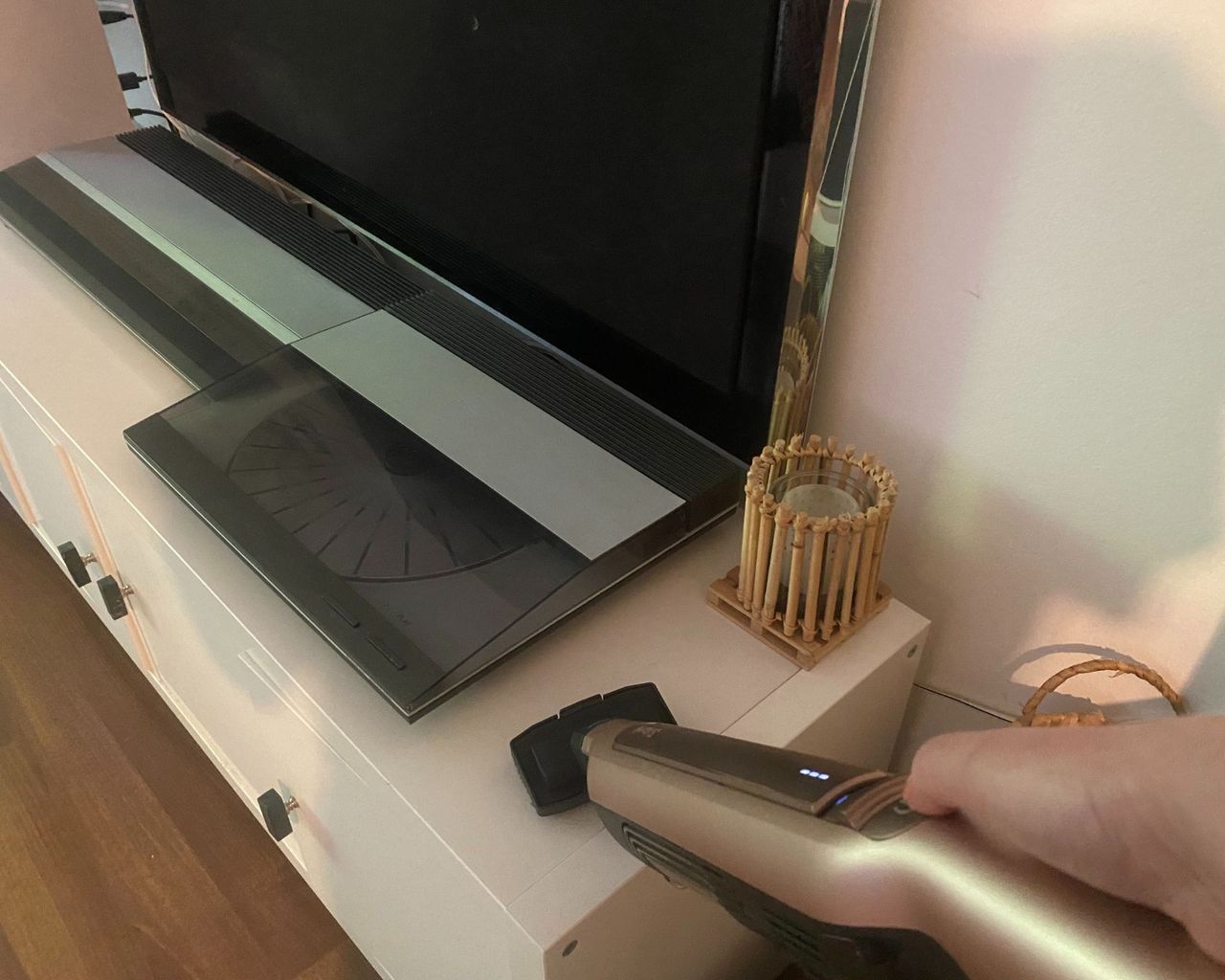 Shark Wandavac with multi surface tool cleaning a TV unit