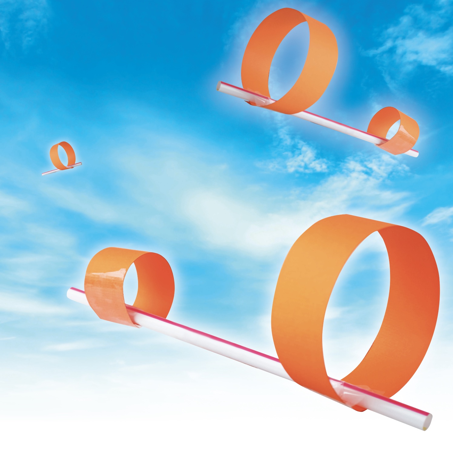 gliders made out of straw and card on a sky background