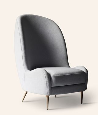 View of the Aril Side Chair - a grey chair with a high back and tall metal legs pictured against a light coloured background