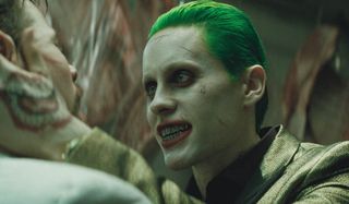 Suicide Squad Joker interrogates a man close up