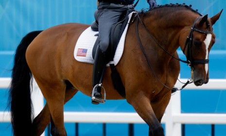 Jan Ebeling of the U.S. team rides Rafalca, Ann Romney&amp;#039;s horse, during a training session in London for the equestrian dressage competition.