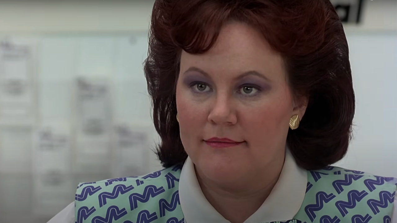 Edie McClurg stares forward with a knowing glare in Planes, Trains and Automobiles.