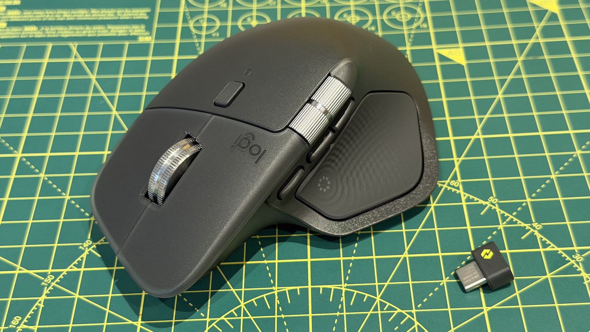 The Logitech MX Master 4 mouse on a graphing grid
